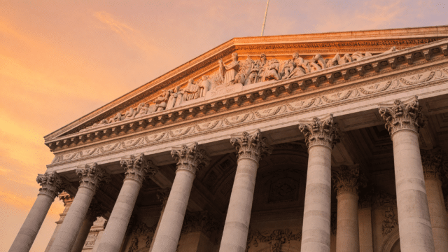 Warm sunset light on the neoclassical columns of a London financial landmark building